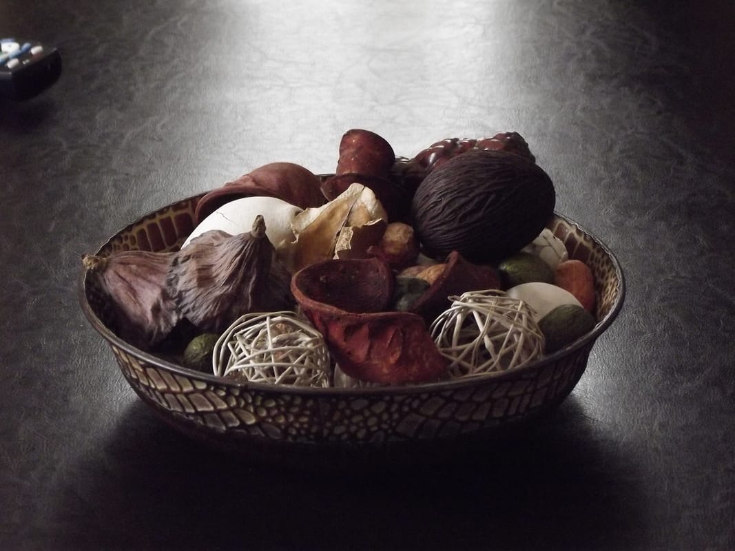 Picture of bowl of potpourri with distracting item showing in frame