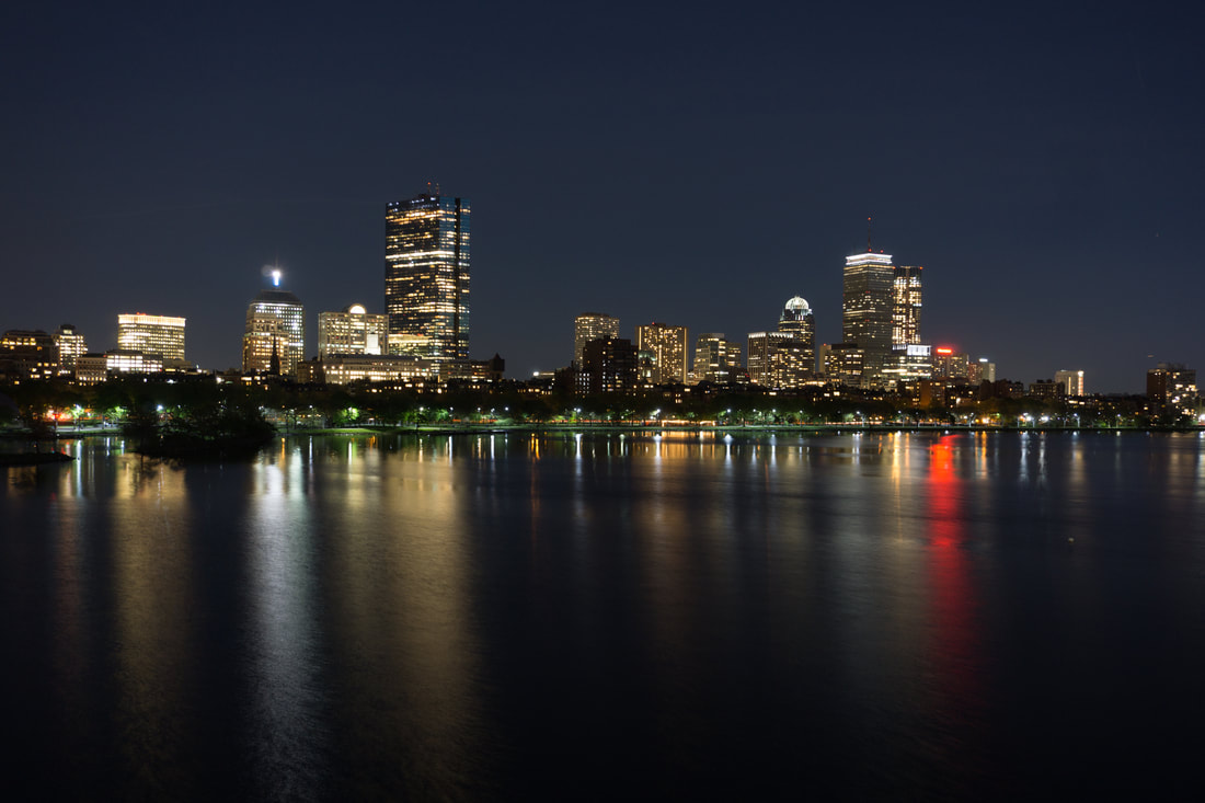 Night photography image of Boston sklyline and Charles River