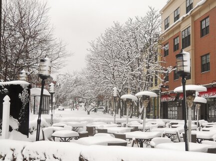 Image showing restaurant tables and chairs  outdoors covered with snow